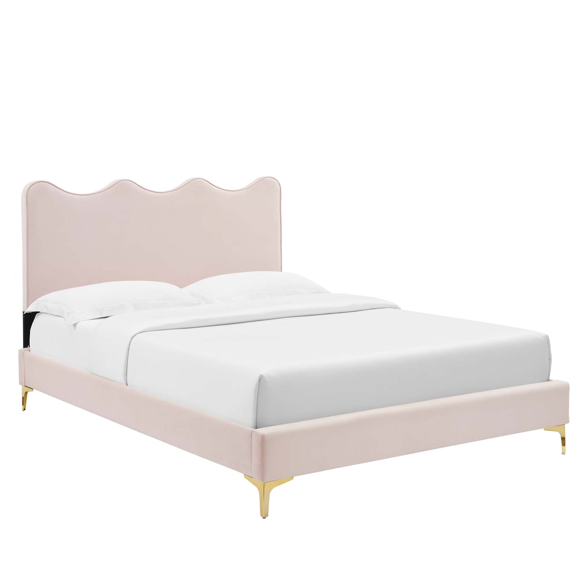 Velvet twin platform bed with scalloped headboard, blush pink upholstery and gold legs, white bedding.