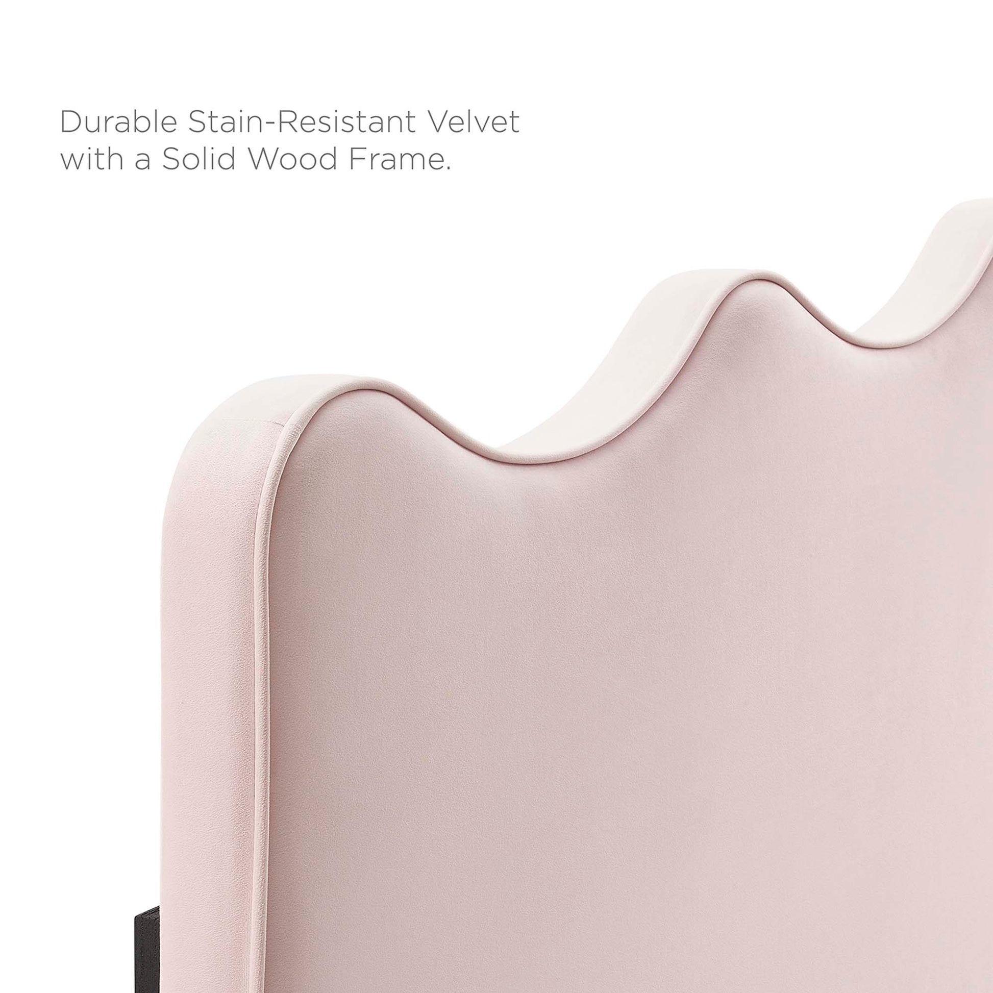 Soft pink velvet headboard with a wave-scalloped top and solid wood frame; modern glam style.