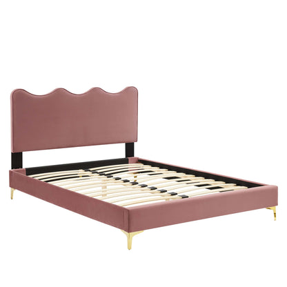 Red performance velvet full platform bed with upholstered headboard, black support bar, wood slats & gold legs.