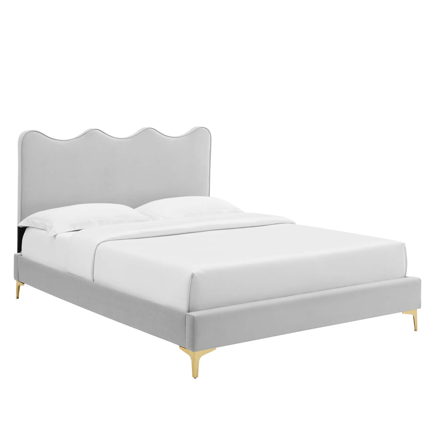 Gray upholstered platform bed with a scalloped wave headboard, white bedding, and gold-tone legs.