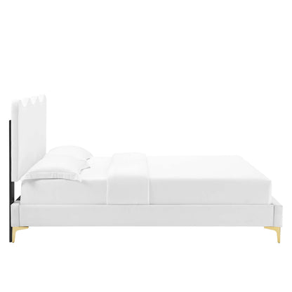 White upholstered platform bed with tall scalloped headboard, gold-tone legs, clean contemporary design.