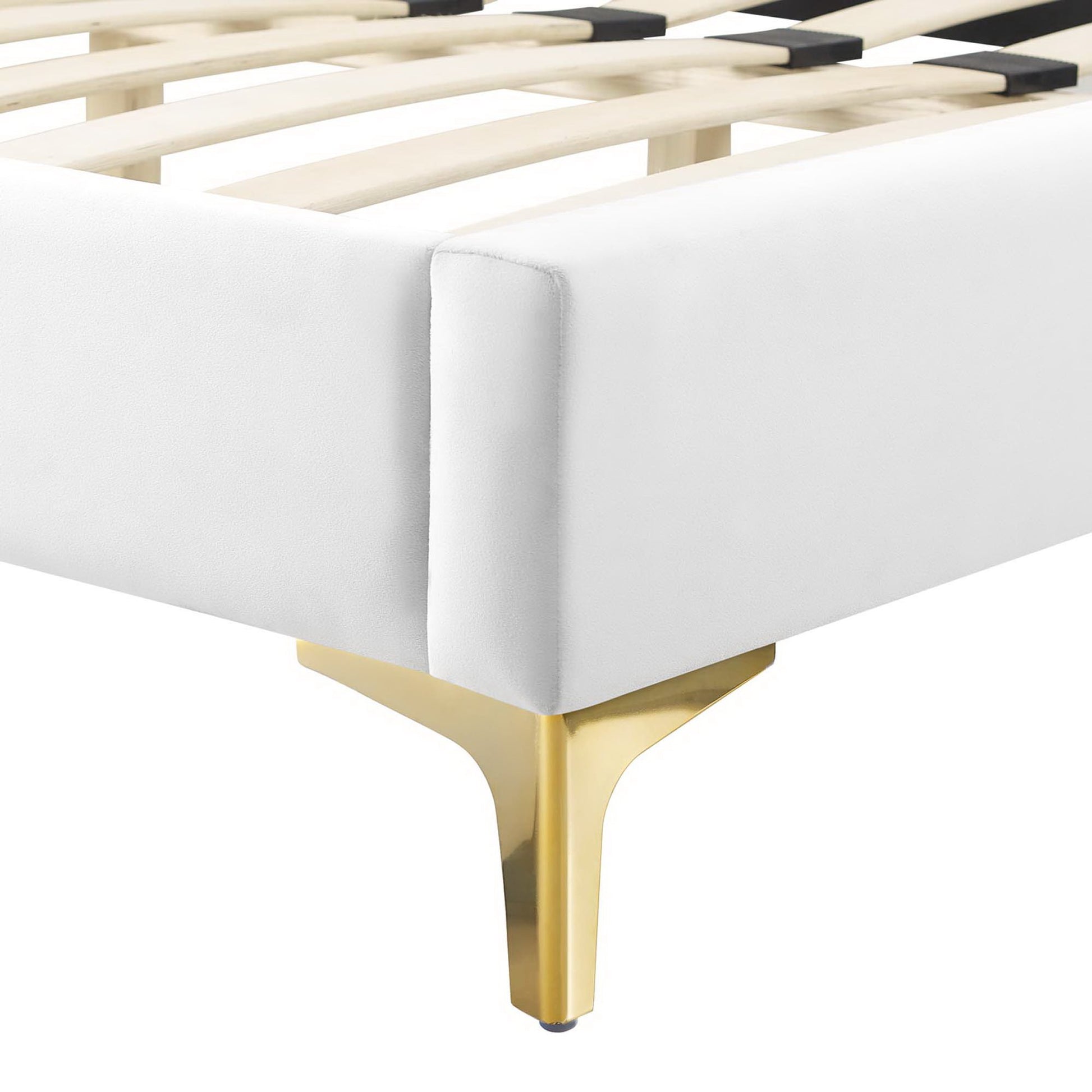 White upholstered full platform bed frame with wooden slats and gold-toned metal legs, modern corner design.