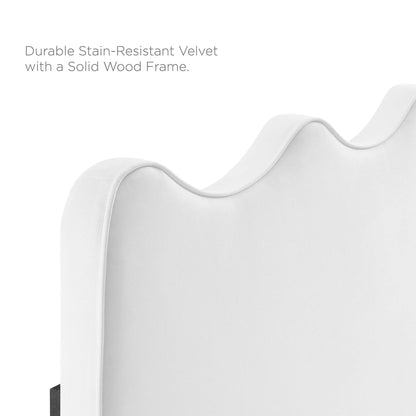White stain-resistant velvet platform bed with a curved, wave-like headboard and solid wood frame.