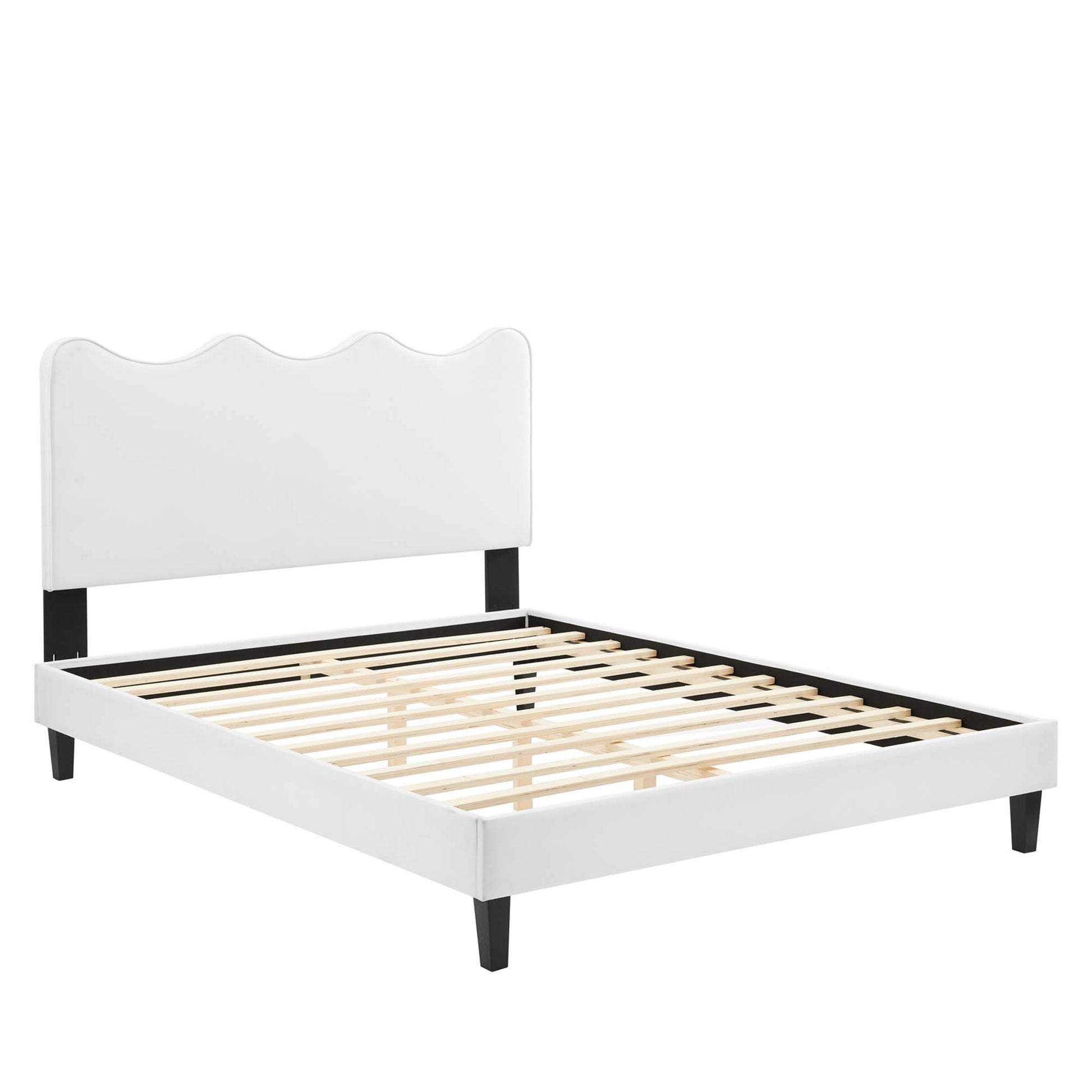 White velvet full platform bed with scalloped headboard, black supports, wooden slats, low-profile modern design.