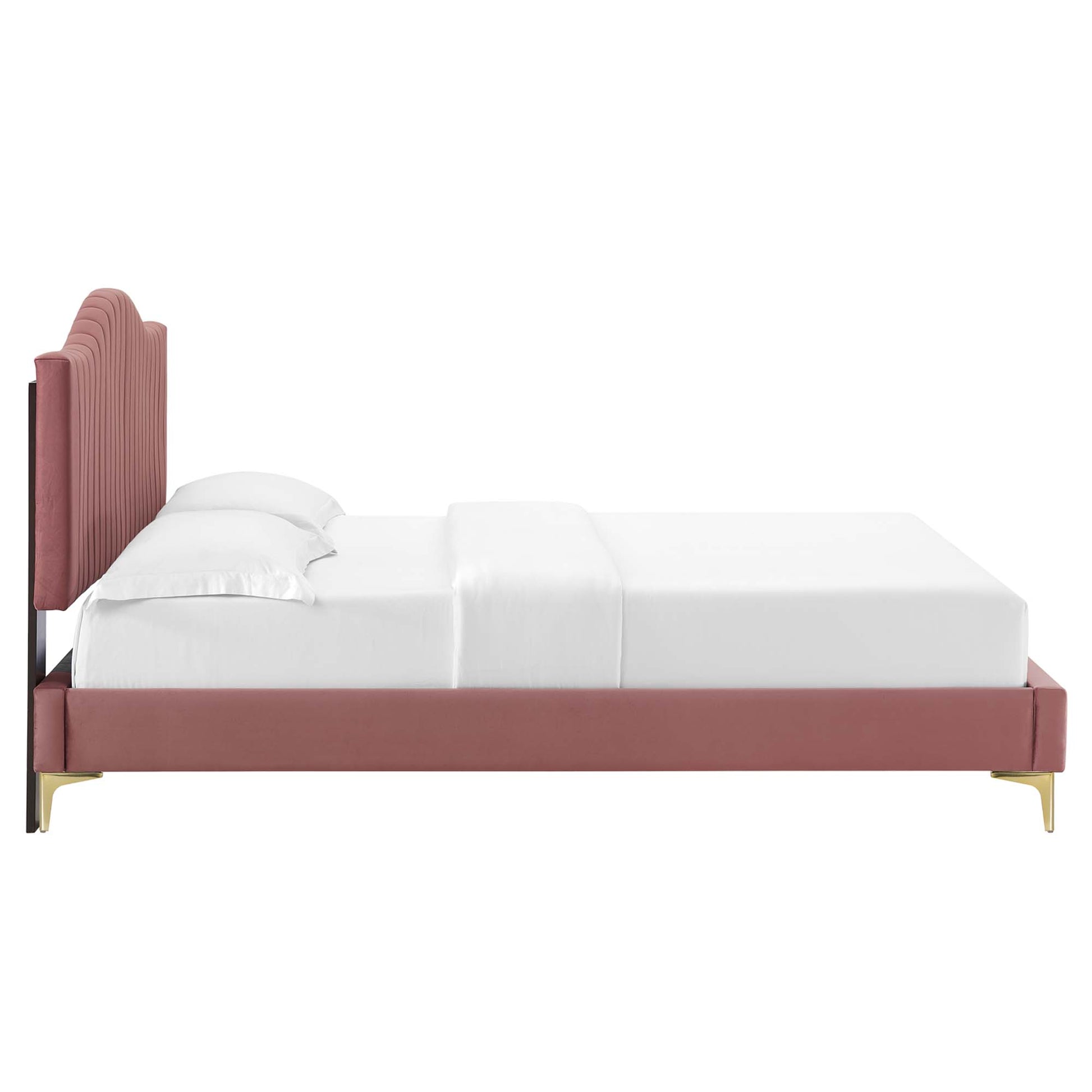 Dusty rose velvet bed with tall curved, ribbed headboard, low platform frame and gold legs, white bedding.