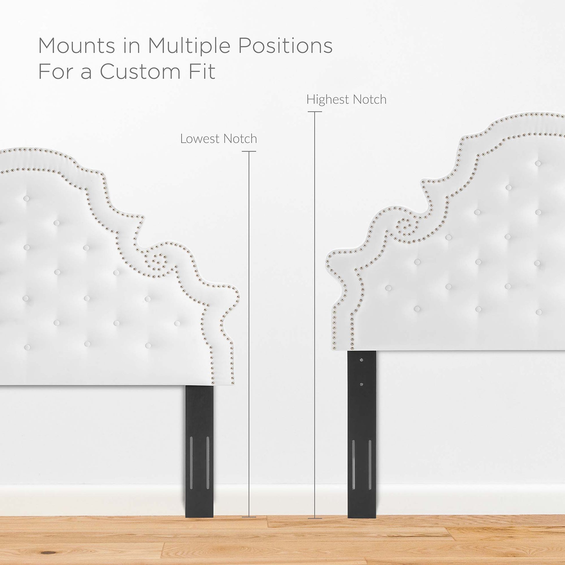 White tufted queen platform bed with a padded headboard, scalloped dotted trim, black legs, and adjustable mounting positions.