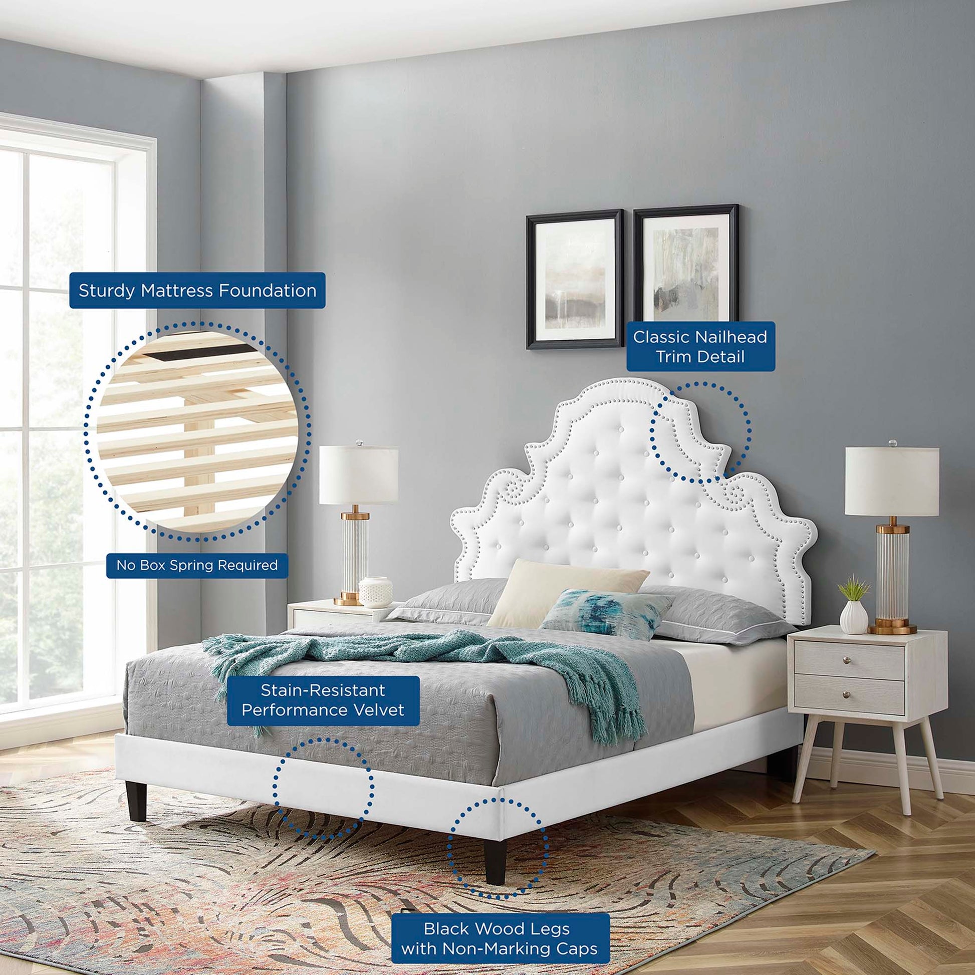 White tufted velvet twin platform bed with nailhead trim and black wood legs in a modern gray bedroom.