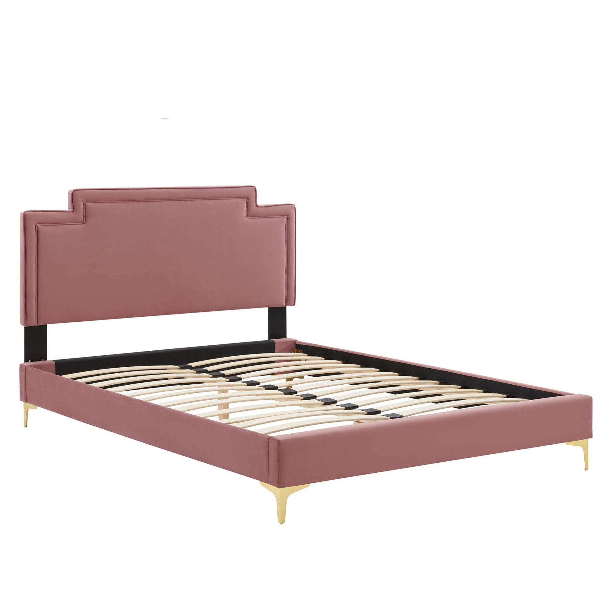Dusty rose upholstered king bed with a stepped headboard, black supports, gold tapered legs and a slatted base.