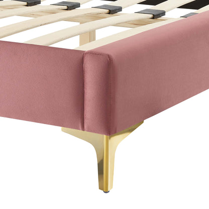 Dusty rose velvet king bed with light wood slats and gold metal legs.