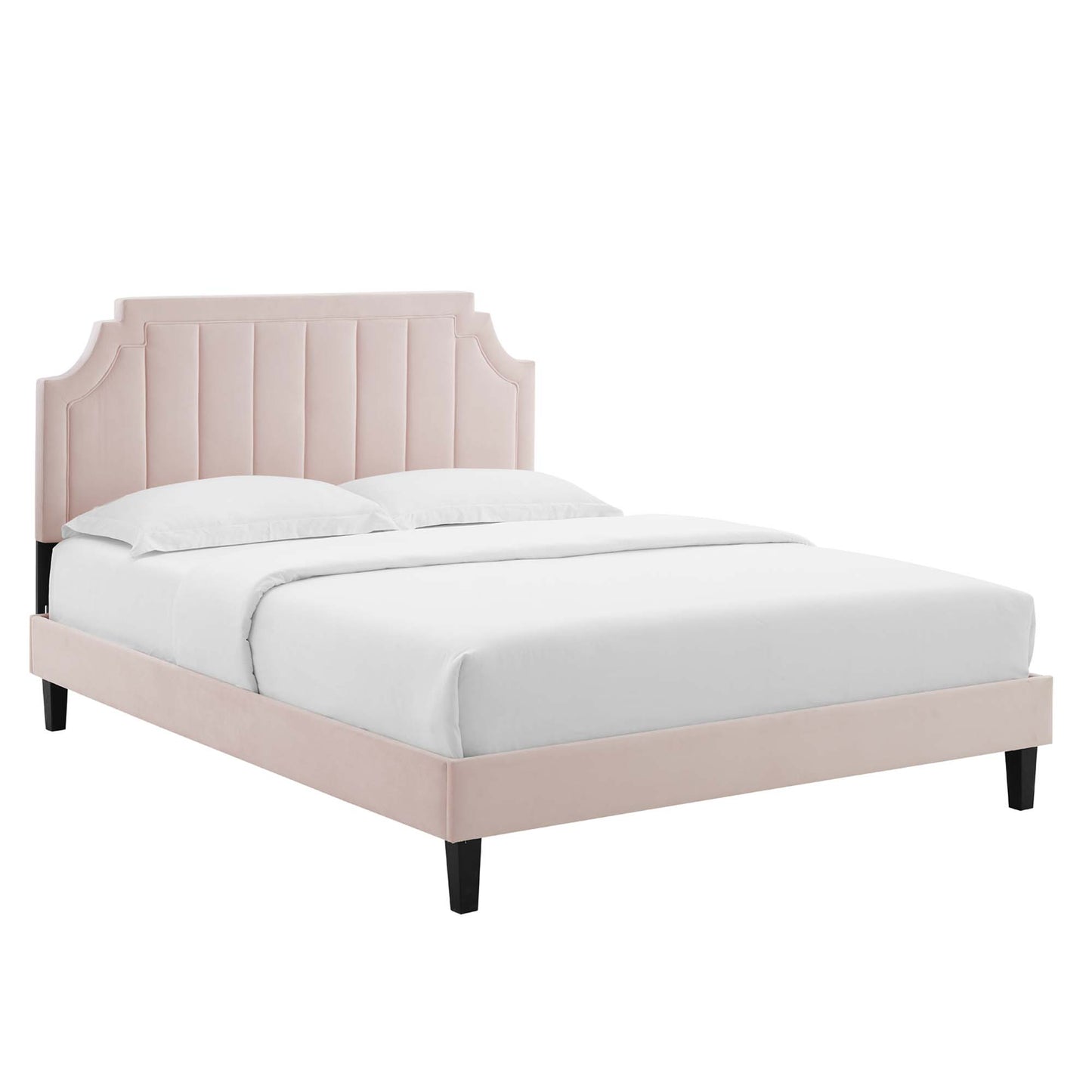 Red velvet twin platform bed with curved, channel-tufted headboard, low-profile platform frame and black tapered legs, white bedding.