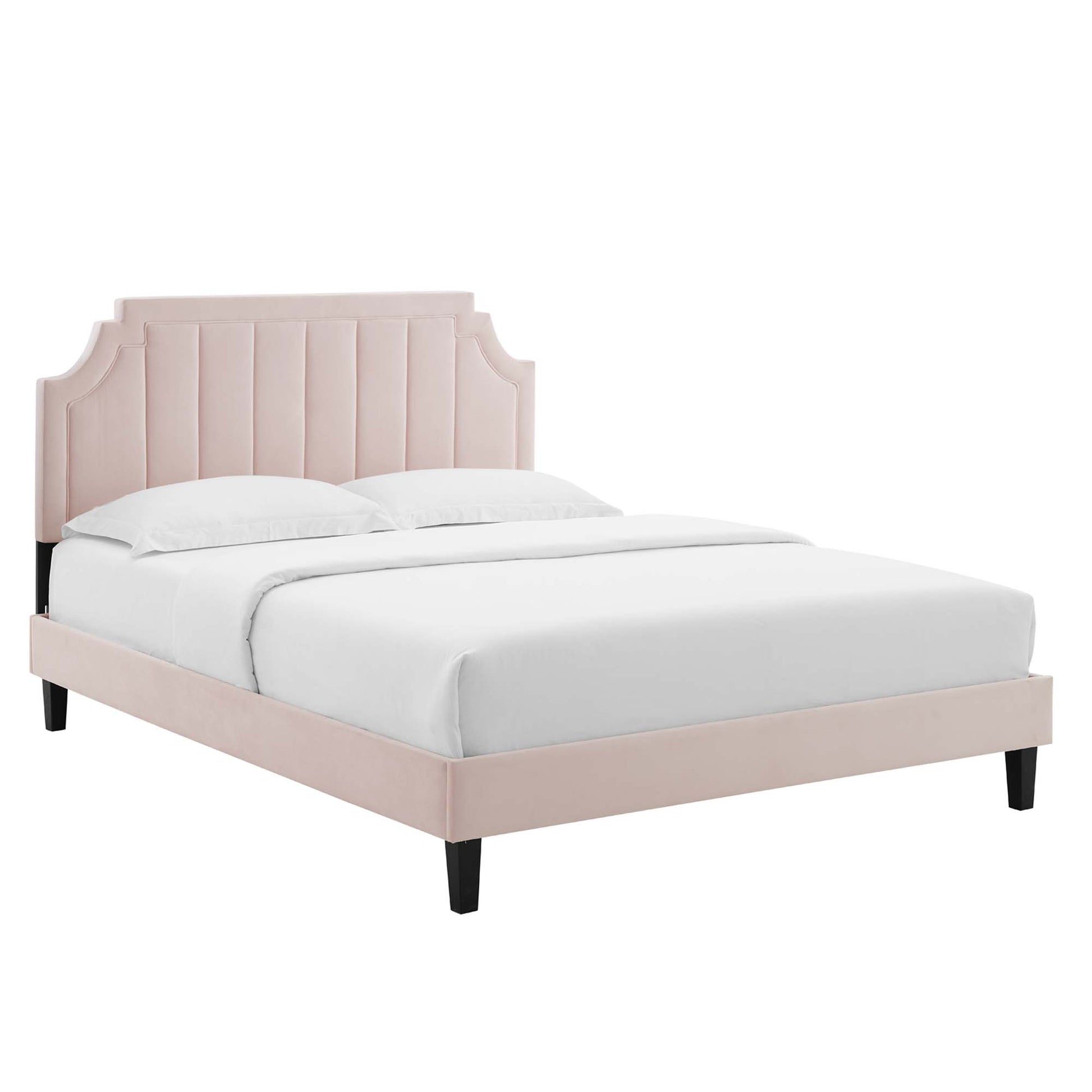 Red velvet twin platform bed with curved, channel-tufted headboard, low-profile platform frame and black tapered legs, white bedding.