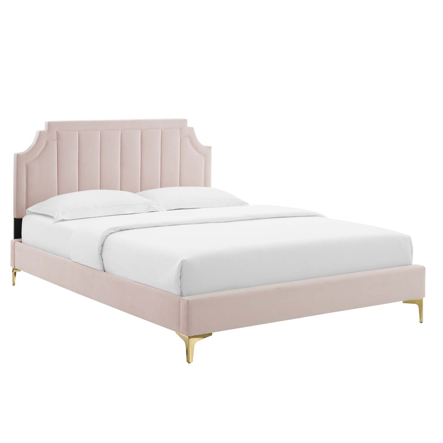 Blush pink upholstered bed with tufted curved headboard, gold legs, and white linens.