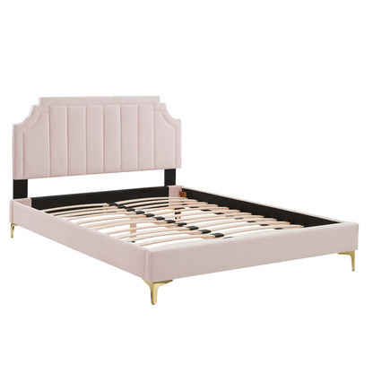 Red upholstered full platform bed with tall curved headboard, black rails, gold tapered legs, and slatted support.