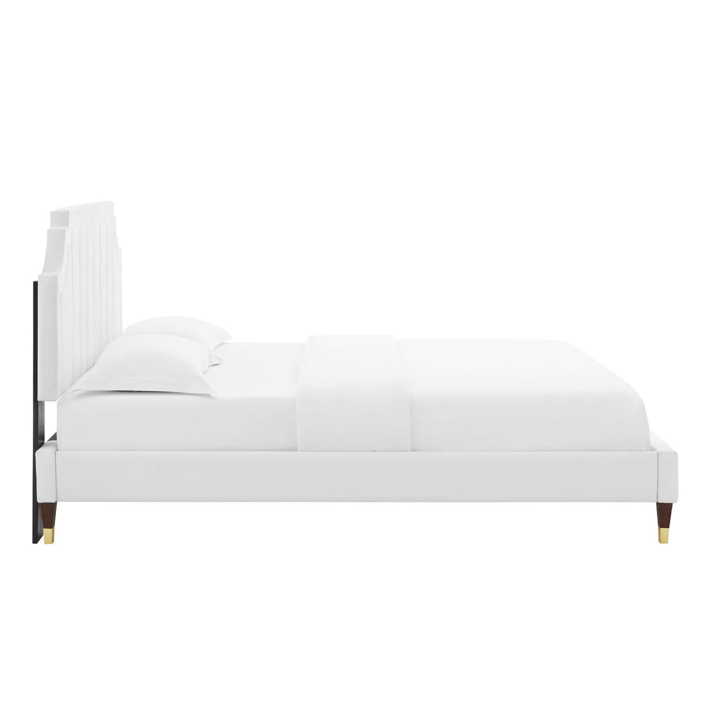 White upholstered platform bed with tall vertical panel headboard, clean modern lines, gold-tipped legs, white bedding.