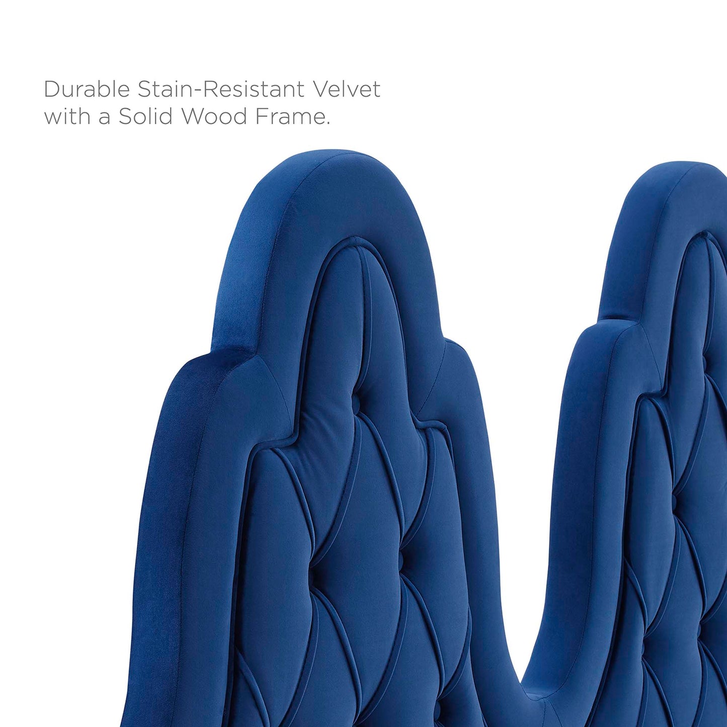 Navy tufted performance velvet twin platform bed with a padded headboard