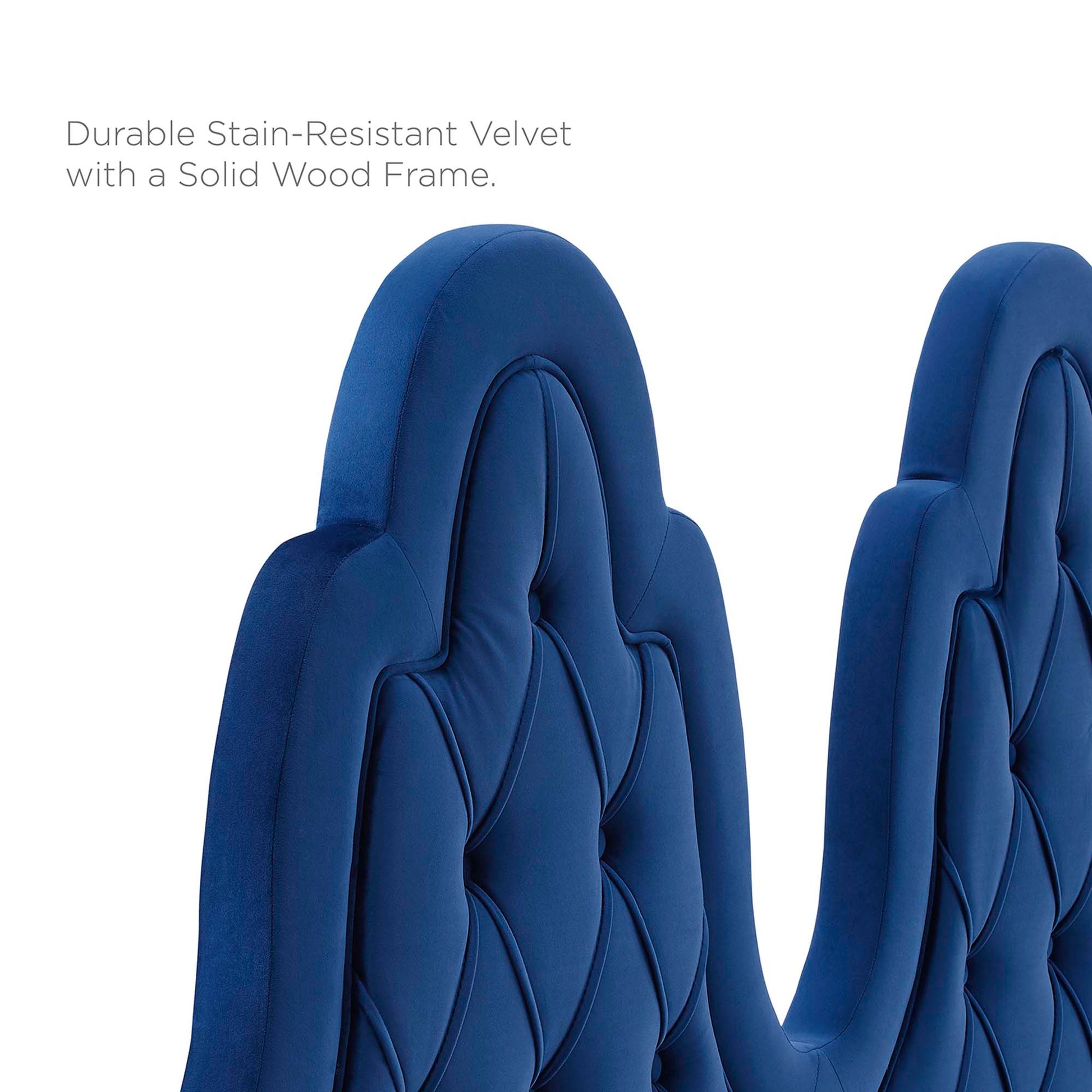 Navy tufted performance velvet twin platform bed with a padded headboard
