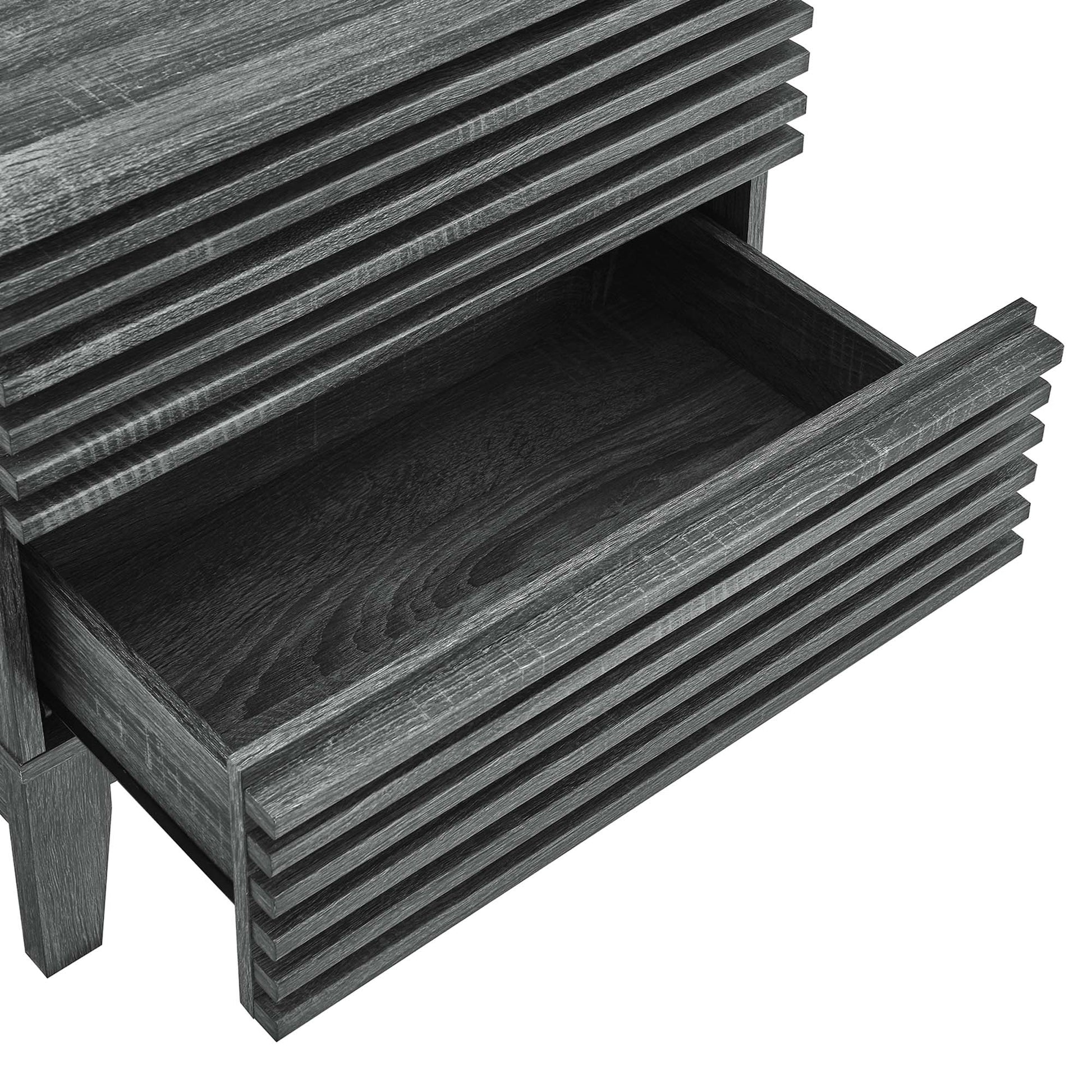 Black two-drawer nightstand with ribbed, grooved fronts; lower drawer open reveals wood grain interior.