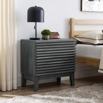 Charcoal gray two-drawer nightstand with a black dome lamp and a small plant beside a wood bed in a modern rustic bedroom.