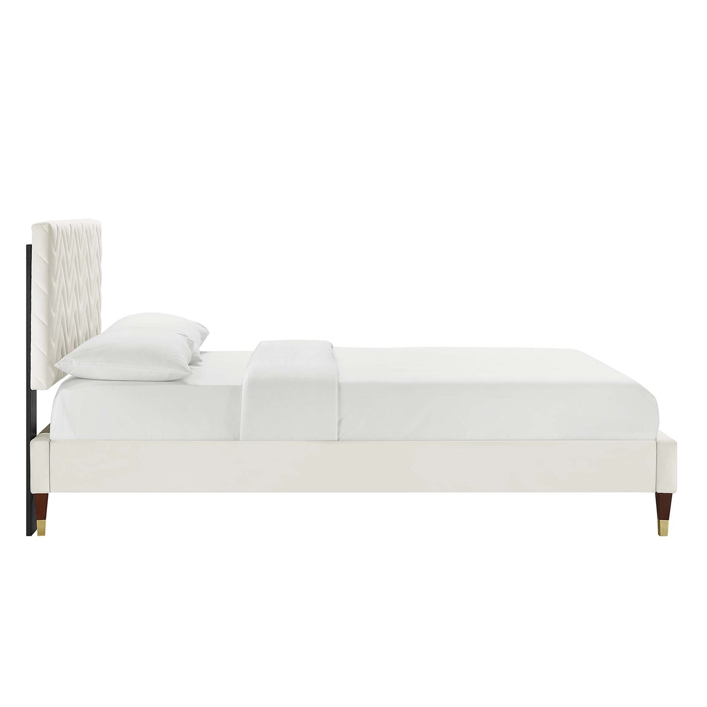 White upholstered platform bed with tall quilted headboard, cream fabric, slim gold-tipped legs, modern style.