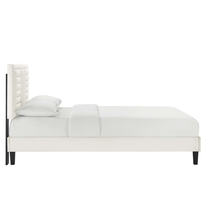 White upholstered platform bed with tufted headboard, minimalist design & black tapered legs.