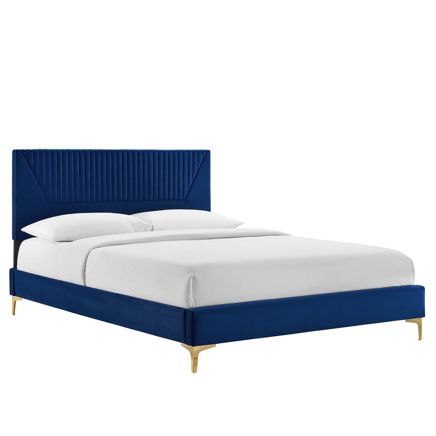 Navy velvet twin platform bed with tall, channel-tufted headboard, low frame, gold legs, and white bedding.