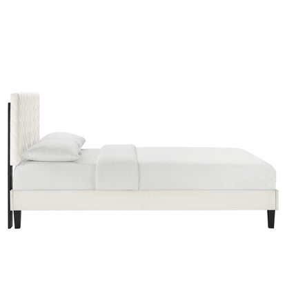 White twin platform bed with chevron-tufted velvet headboard and dark tapered legs; modern minimalist design.