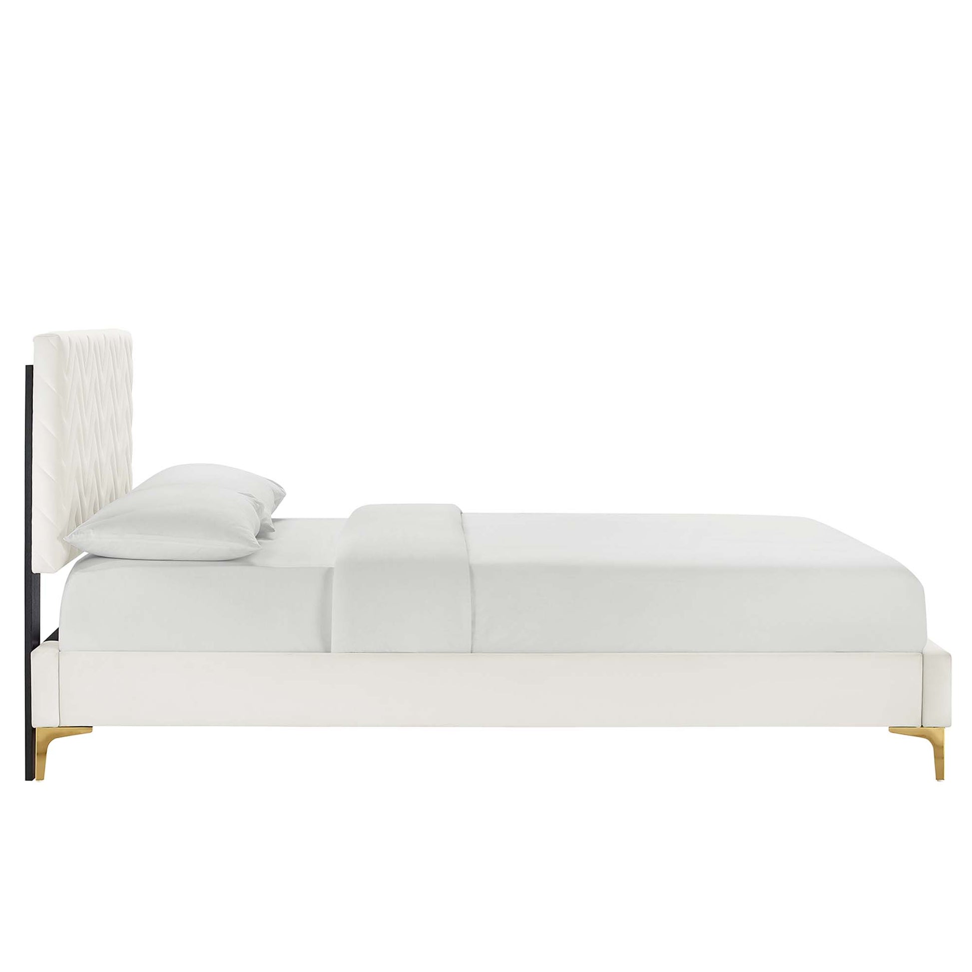 White upholstered platform bed with tall tufted headboard, gold legs, and a minimalist modern design.