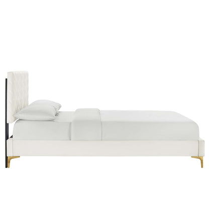 White upholstered platform bed with tall tufted headboard, gold legs, and a minimalist modern design.
