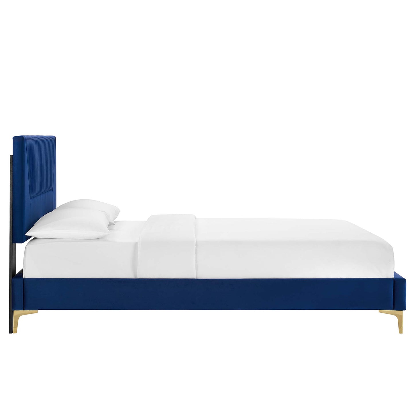 Navy blue upholstered platform bed with tall headboard, white bedding and gold metal legs.