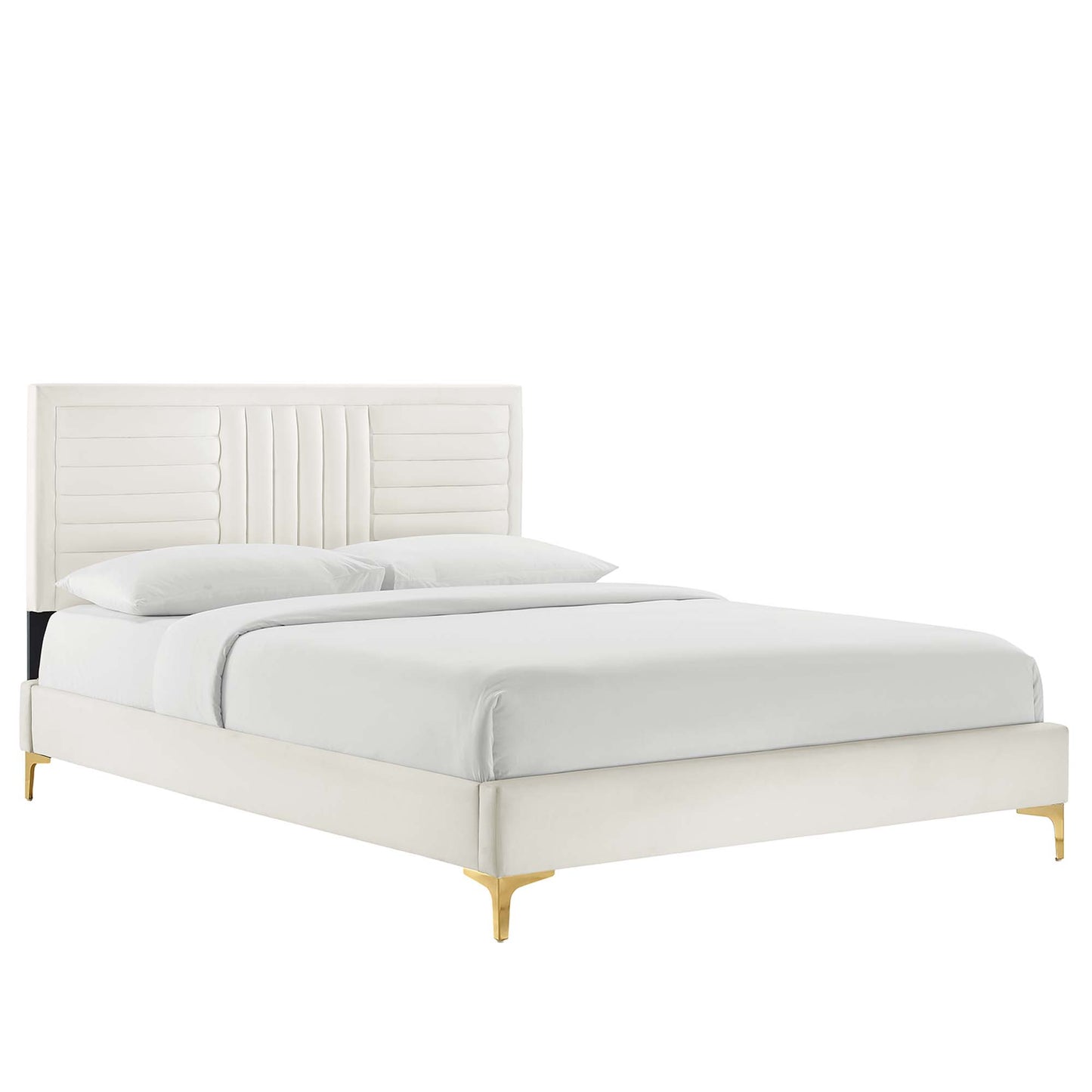 Ivory upholstered platform bed with tall paneled headboard & vertical channel tufting, low frame & gold legs, white bedding.