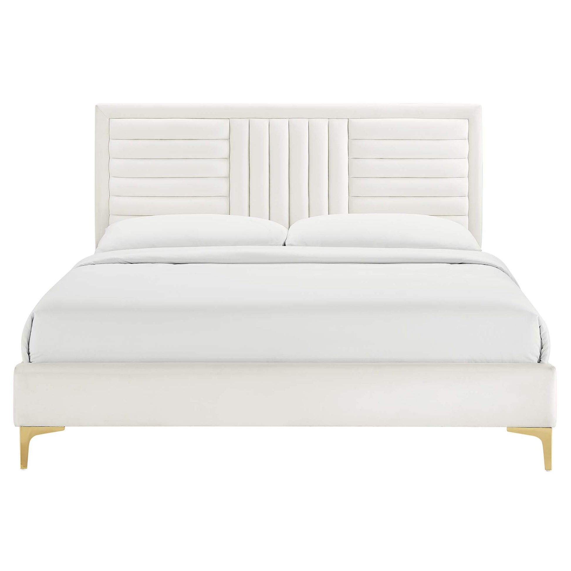 White channel-tufted velvet platform bed with white bedding.