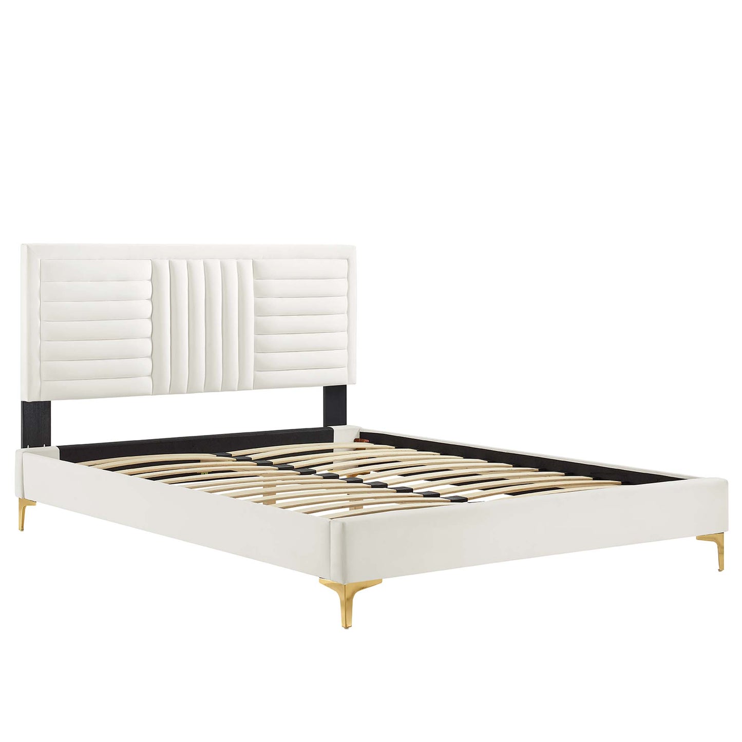 White upholstered platform bed with tall tufted headboard, black side rails, wood slat base and gold legs.