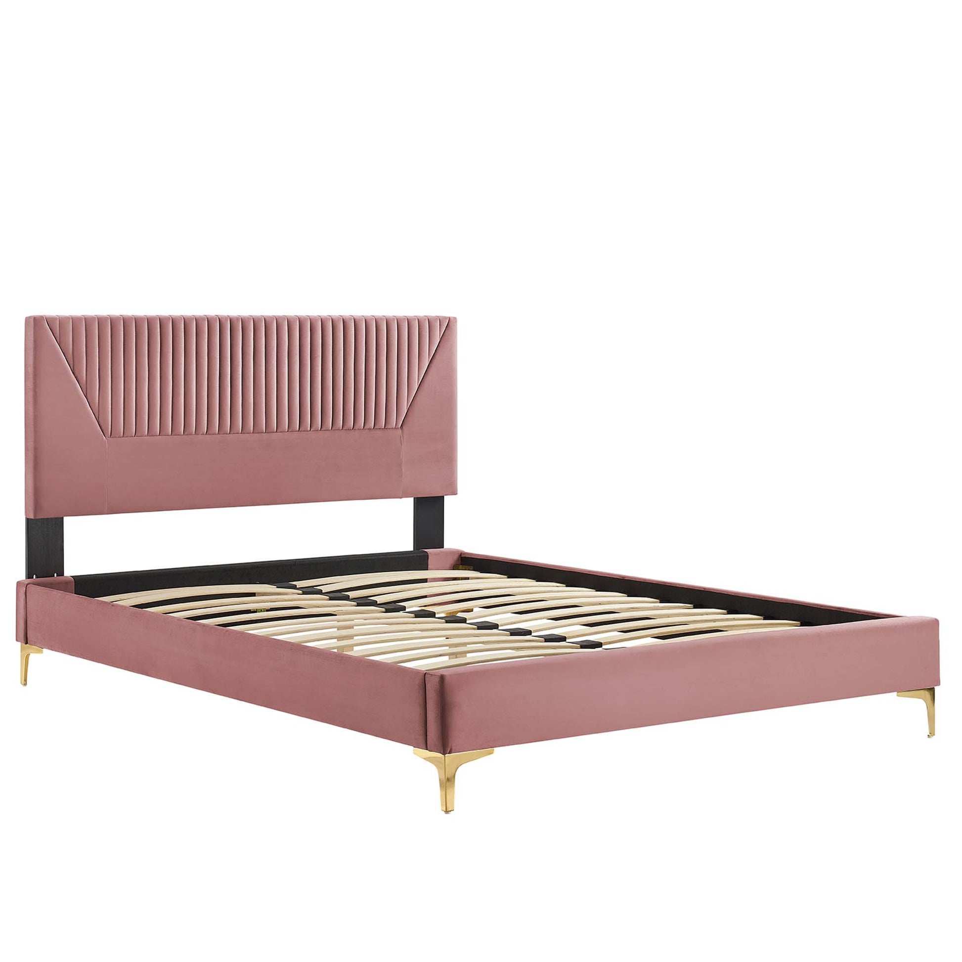 Dusty rose velvet platform bed with channel tufted headboard, black supports, & gold legs, with a slatted wooden base.