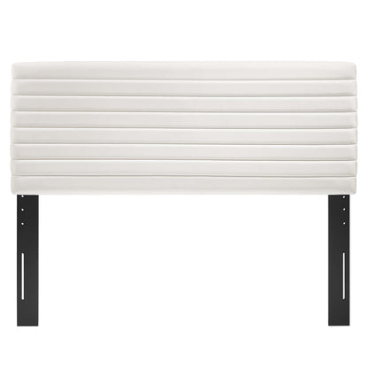 White padded headboard with horizontal channel stitching; black metal legs, modern headboard design.