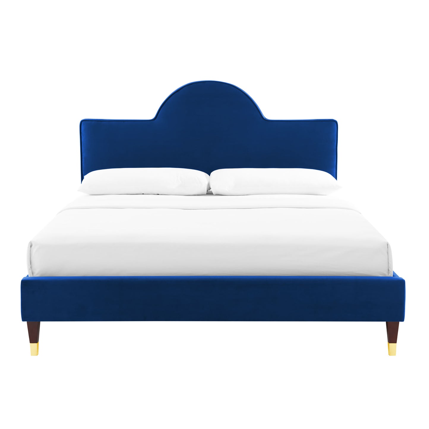 Navy blue velvet upholstered bed with a rounded arch headboard, white linens, and dark wood legs with gold tips.