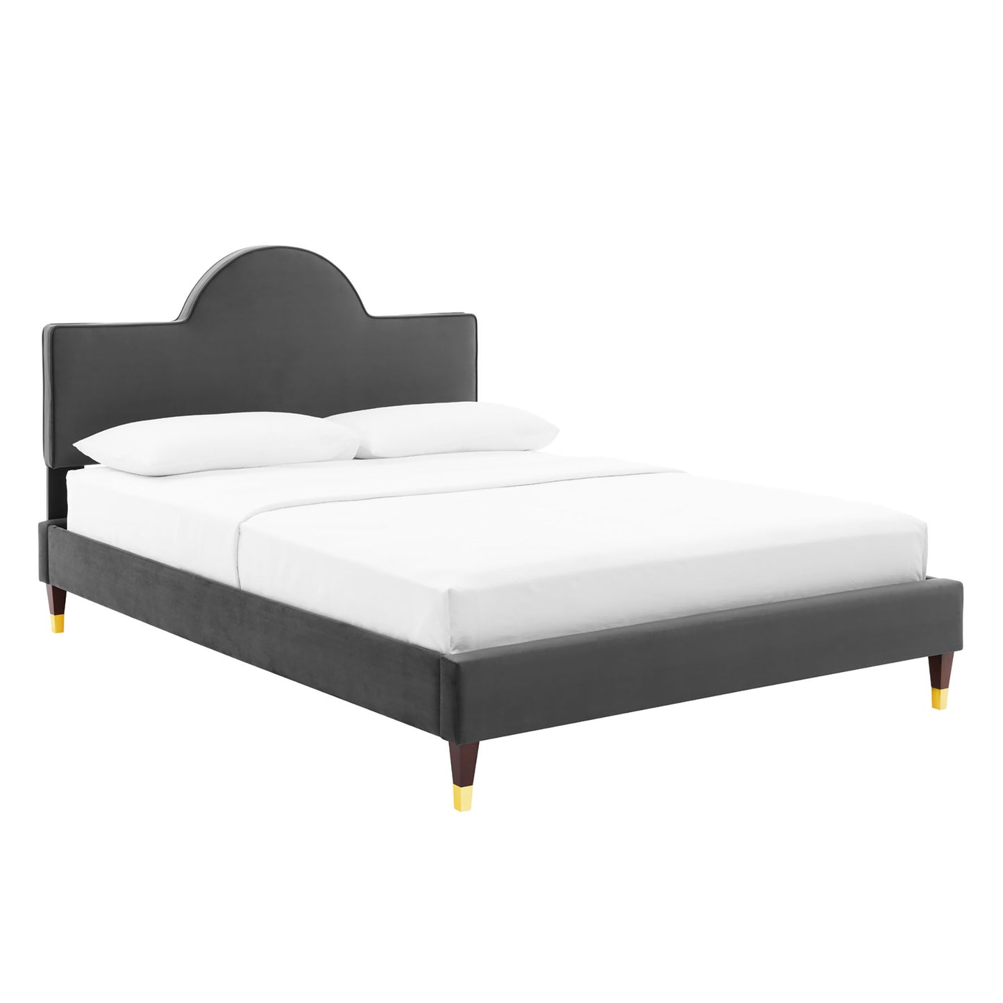 Dark gray upholstered platform bed with curved headboard, white bedding, and wooden legs with gold-toned tips.