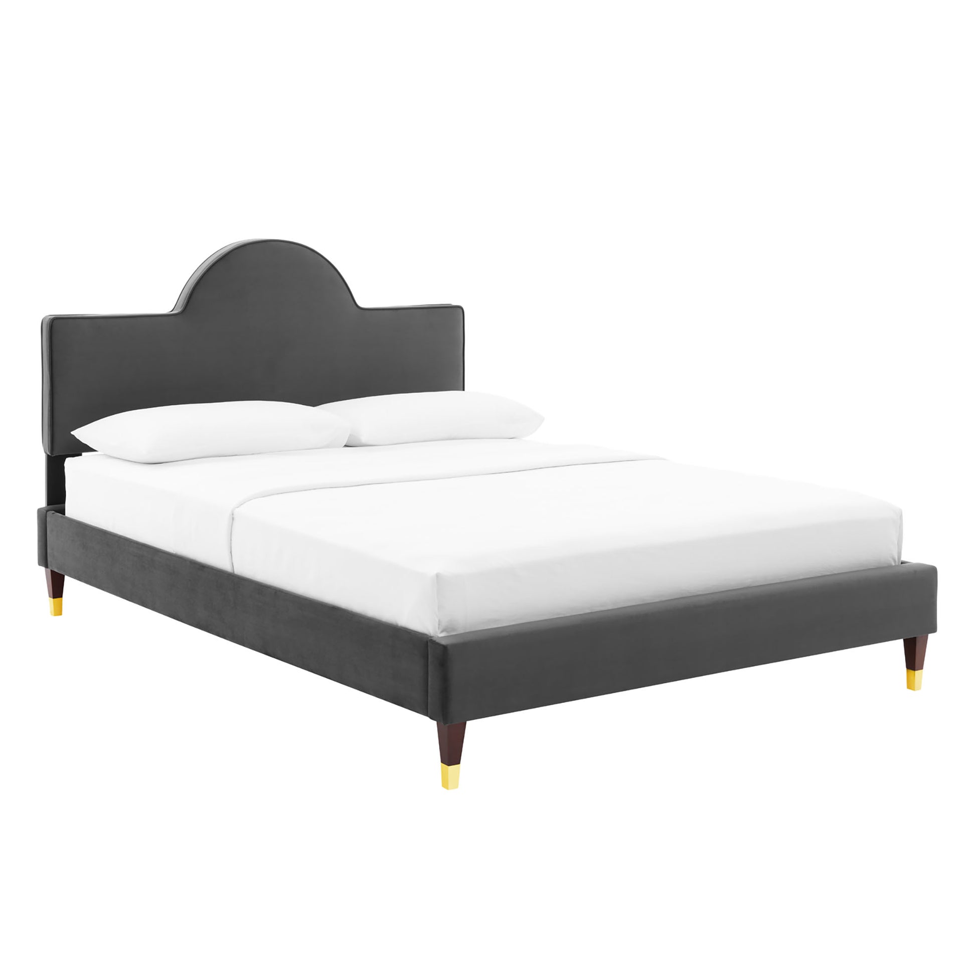 Dark gray upholstered platform bed with curved headboard, white bedding, and wooden legs with gold-toned tips.