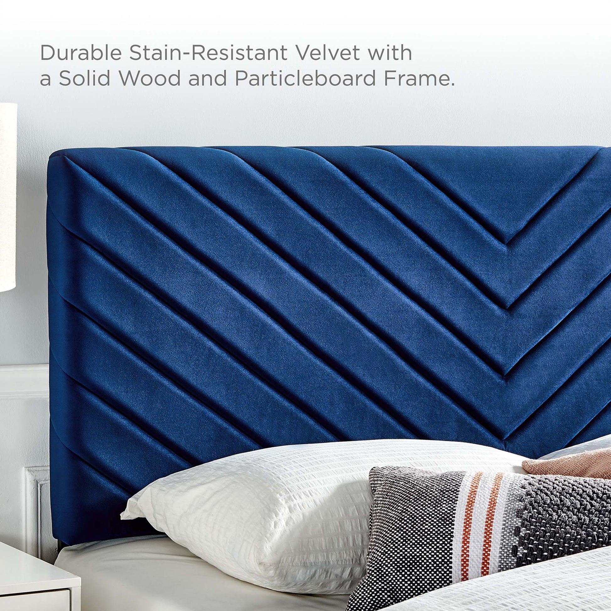 Navy blue velvet full platform bed with a diagonal chevron-tufted headboard and a solid wood and particleboard frame.