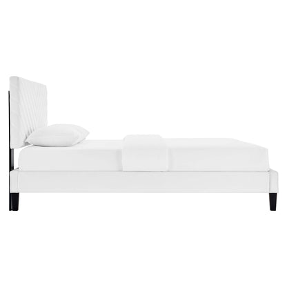 White upholstered platform bed with tall padded headboard, minimalist modern design, dark tapered legs.