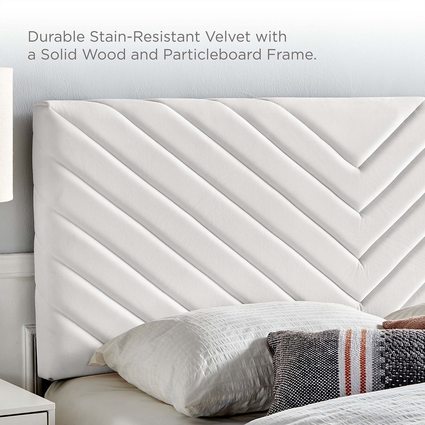 White stain-resistant velvet headboard with diagonal chevron stitching, solid wood and particleboard frame, on white linens.