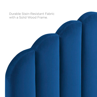 Navy blue upholstered full platform bed with a cushioned headboard and a solid wood frame; stain-resistant fabric.