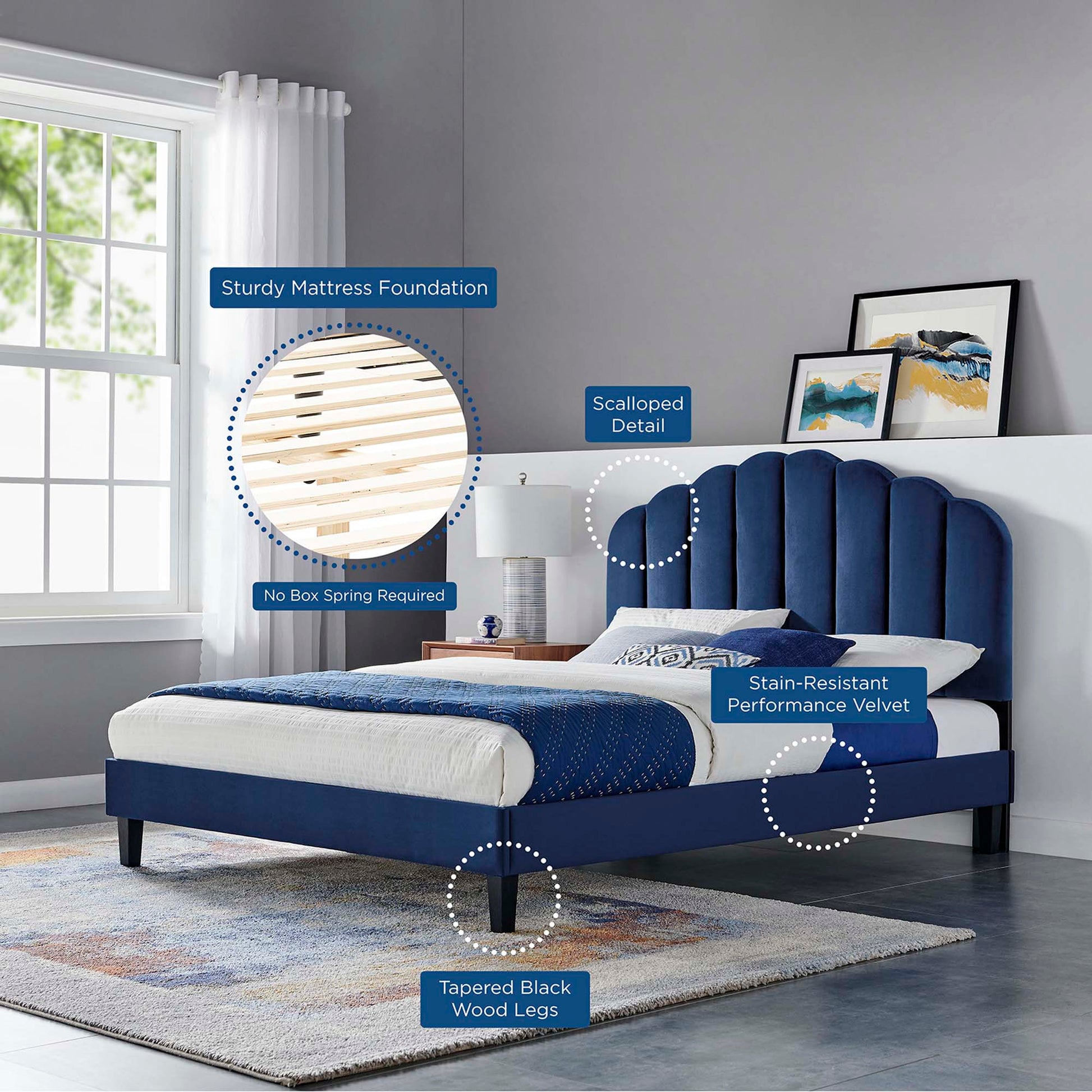 Navy blue velvet full platform bed with scalloped headboard, tapered black wood legs, sturdy mattress foundation, modern bedroom setting.