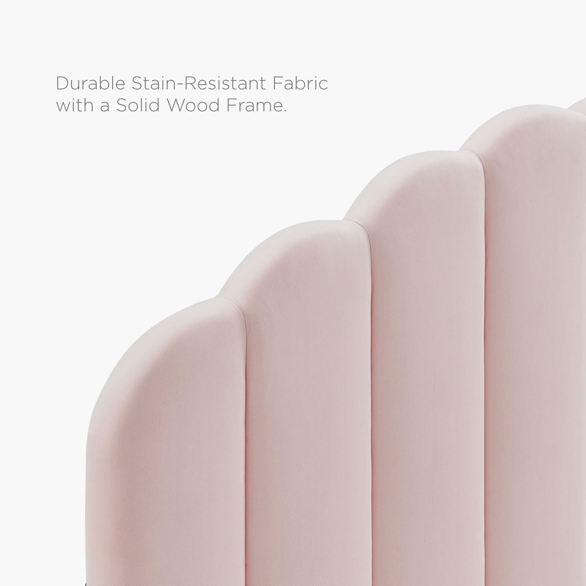Soft pink upholstered full platform bed with a solid wood frame.