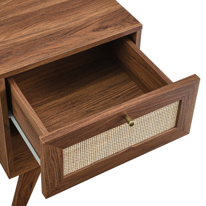 Walnut-finish wooden nightstand with open top drawer & cane-woven front panel, brass knob.