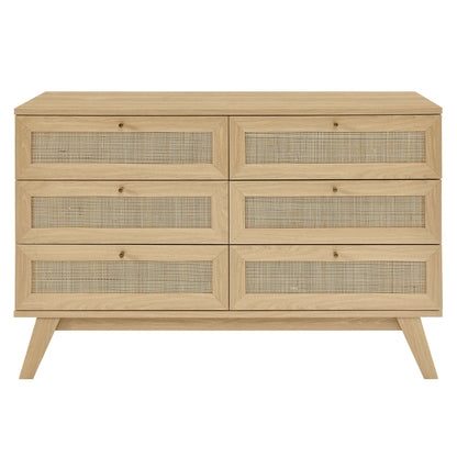 Natural oak dresser with six drawers featuring woven cane fronts, mid-century style, angled legs.