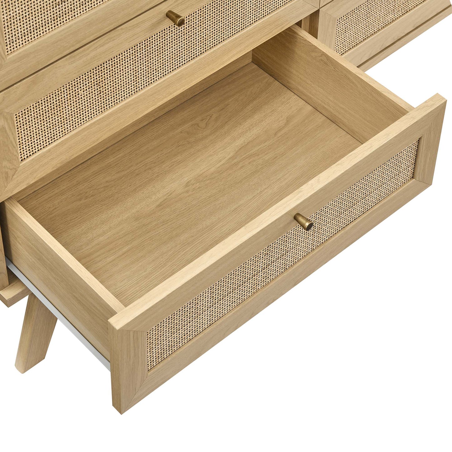 Oak dresser with caned-front drawers and brass knobs; bottom drawer pulled out.