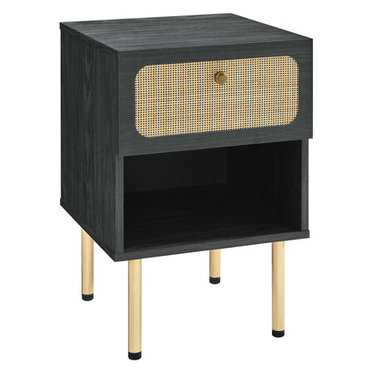 Black nightstand with a cane-front drawer, open lower shelf, & gold metal legs.