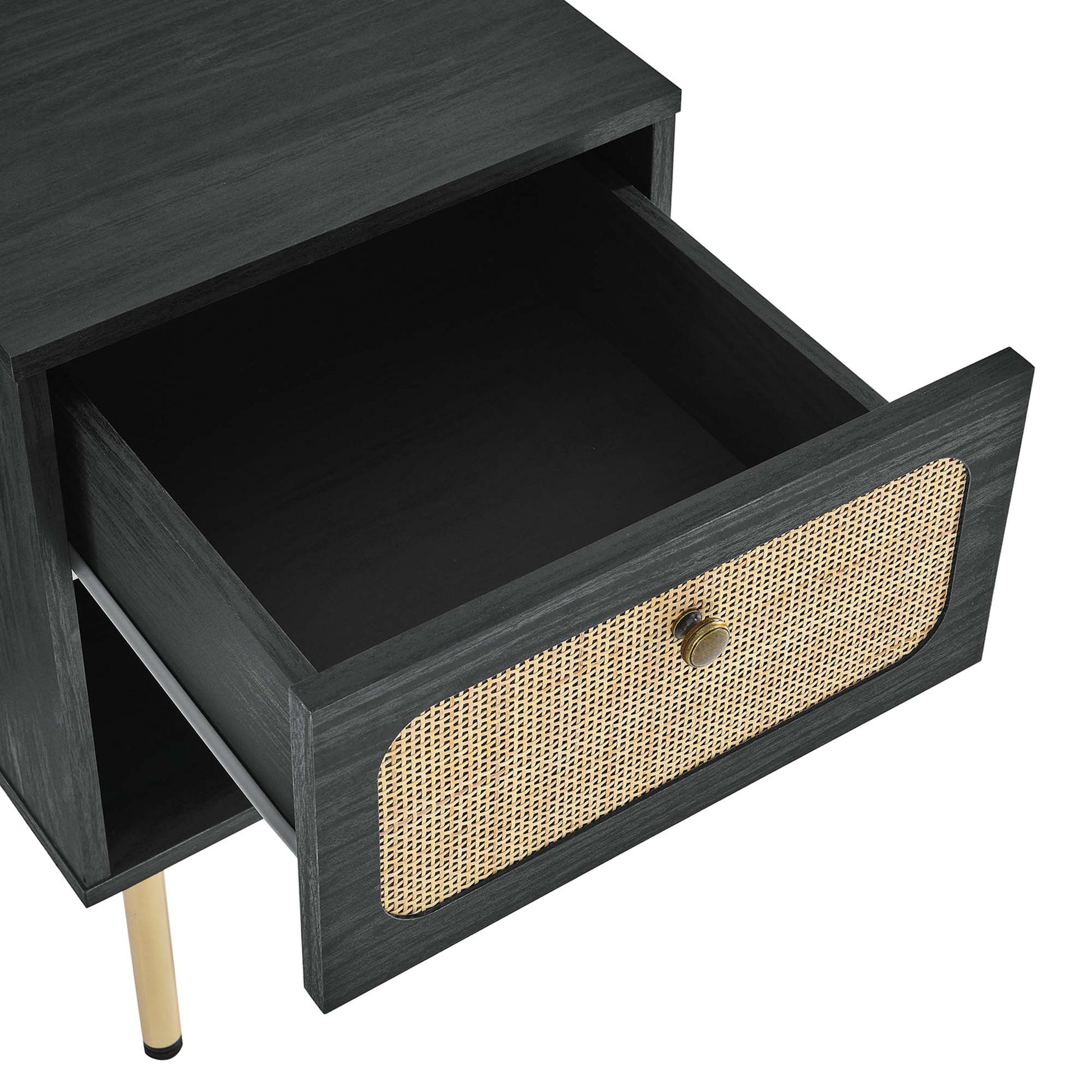 Dark black wood nightstand with a woven cane front drawer, brass knob, and slim gold metal legs.