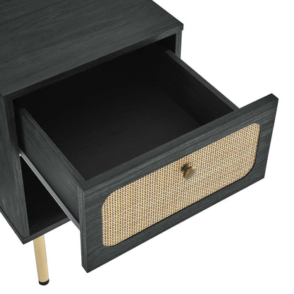 Dark black wood nightstand with a woven cane front drawer, brass knob, and slim gold metal legs.