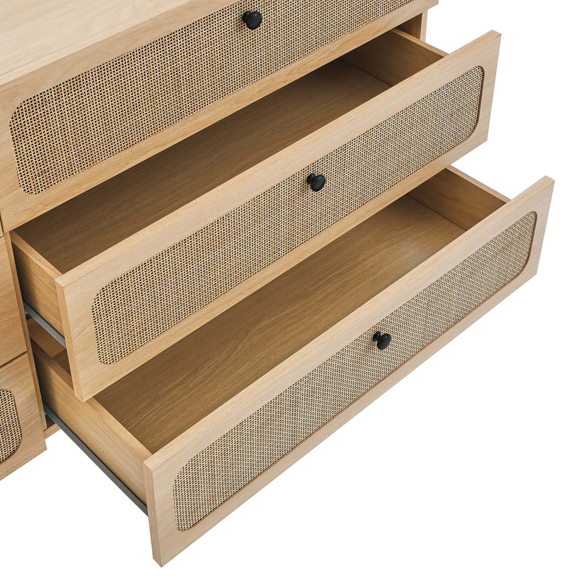 Light oak dresser with woven cane-front drawers and round black knobs, mid-century modern storage.